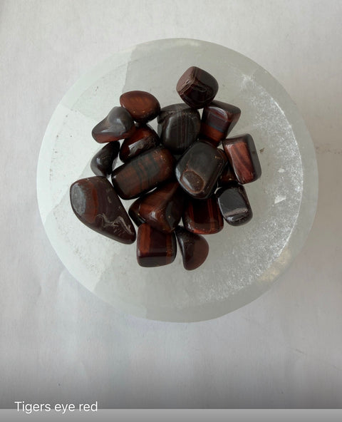 Red Tiger's Eye Tumbled Stones group — polished red and brown crystals for focus, drive, and protection.