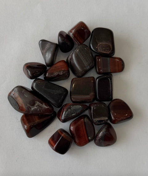 Red Tiger's Eye Tumbled Stones — natural banded crystals for Root Chakra, grounding, and confidence.