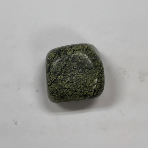 Serpentine tumbled stone healing crystal pieces for meditation, emotional balance, and holistic energy work.