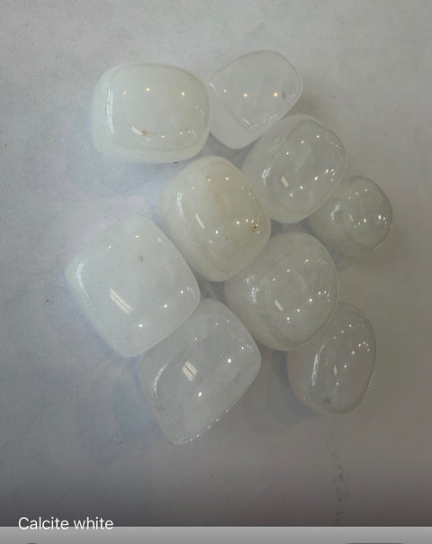 White Calcite Tumbled Stones group — translucent white crystals for meditation, Crown Chakra, and space cleansing.