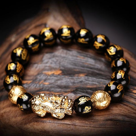 Feng Shui Wealth Bracelet worn on left hand for feng shui crystal intention and manifestation practice.