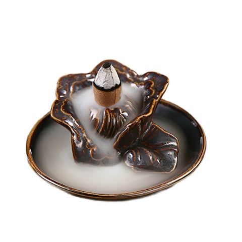 Flower backflow incense burner with romantic floral mist cascading through petals