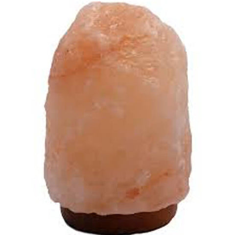 Himalayan Salt Lamp 7-9 Inch placed in bedroom for relaxation, negative ions, and better sleep support.