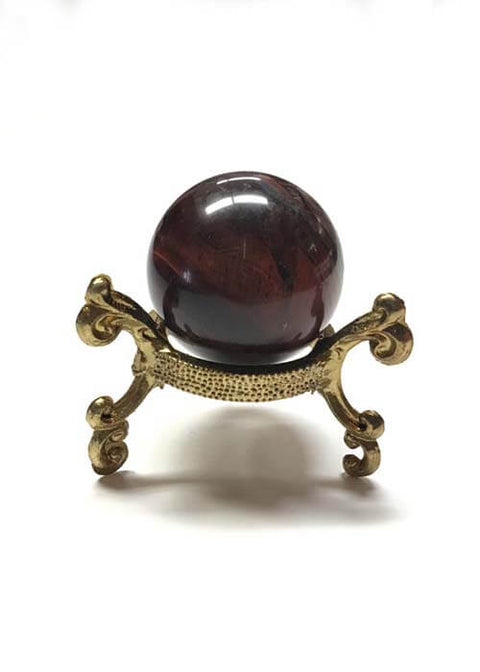 Polished Red Tigers Eye crystal ball for meditation sessions, chakra work, and home altar decor.
