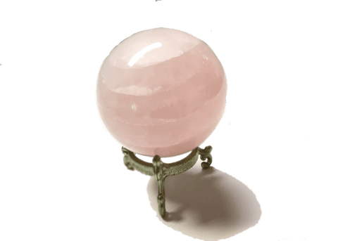 Rose quartz gazing ball for divination practice, crystal healing, and calming room decor.