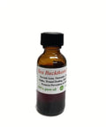 Sea Buckthorn Essential Oil in amber glass bottle with bright orange sea buckthorn berries