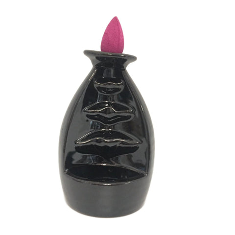 Tower backflow incense burner with dramatic vertical mist cascade down architectural tower form